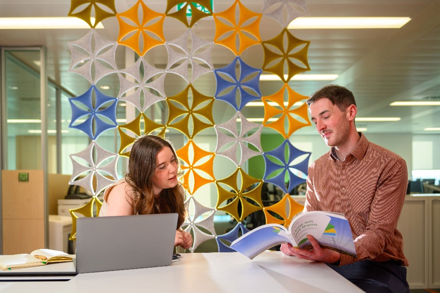 Employees at SP Energy Networks discuss a white paper